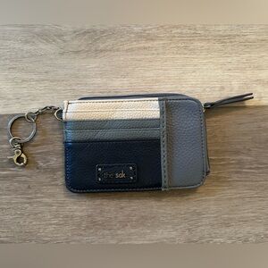The Sak Iris leather card wallet in a multi-tone blue and white block color